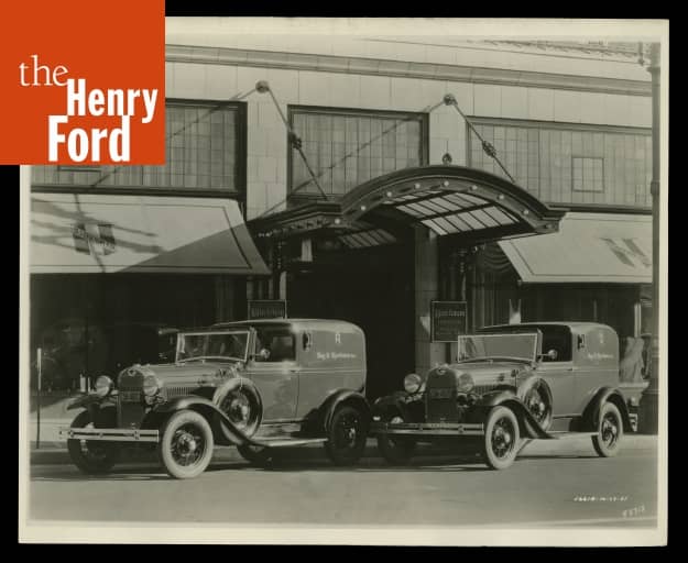Ford Model A Town Car Delivery Trucks outside Roy H. Bjorkman Clothing