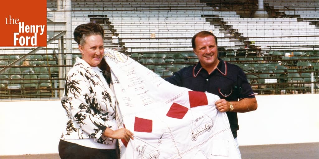 Holder Presents A.J. Foyt with a Quilt as the Winner of the