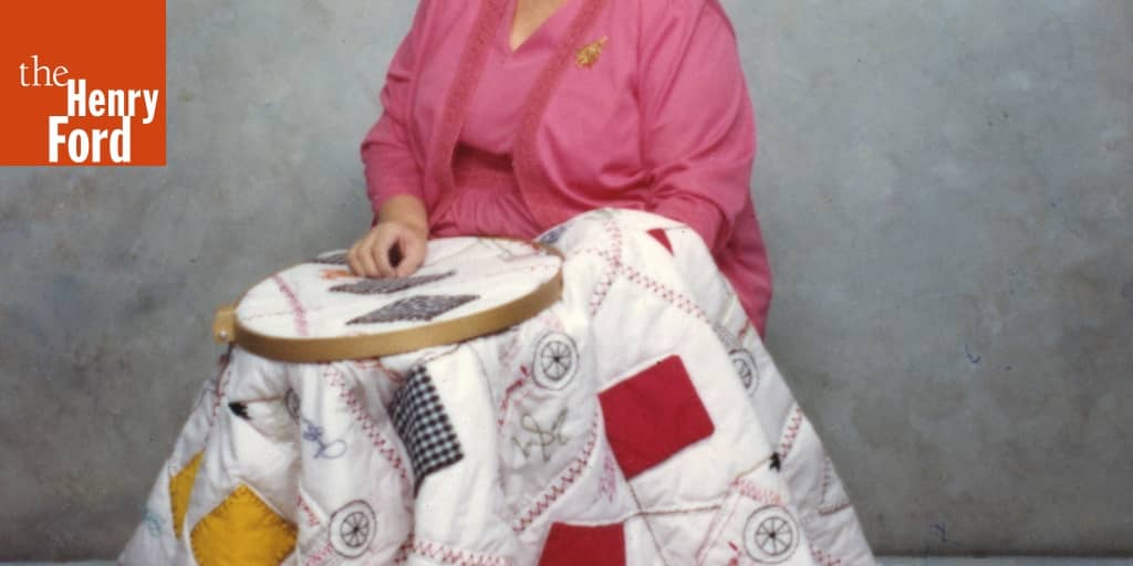 Holder with Her Indianapolis 500 Quilt Made for Bobby Unser